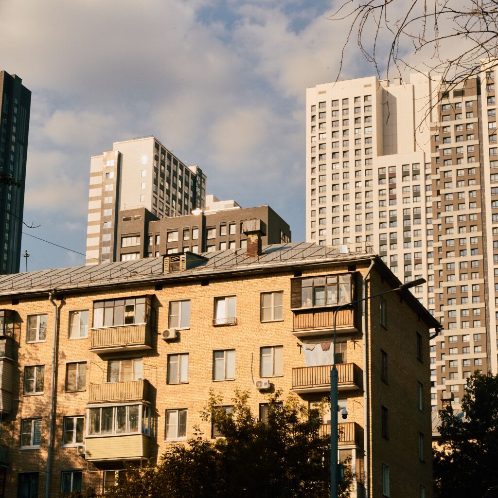 Urban landscape showcasing a mix of modern skyscrapers and vintage brick buildings.